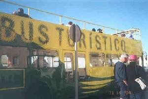 Double decker sightseeing bus.